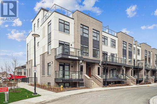 104 - 1569 Rose Way, Milton, ON - Outdoor With Balcony With Facade