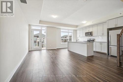 104 - 1569 Rose Way, Milton, ON - Indoor Photo Showing Kitchen With Stainless Steel Kitchen With Upgraded Kitchen