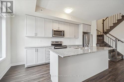 104 - 1569 Rose Way, Milton, ON - Indoor Photo Showing Kitchen With Stainless Steel Kitchen With Upgraded Kitchen