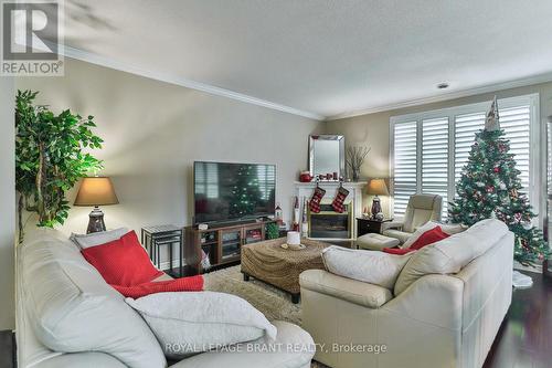 #104 - 255 Keats Way, Waterloo, ON - Indoor Photo Showing Living Room With Fireplace