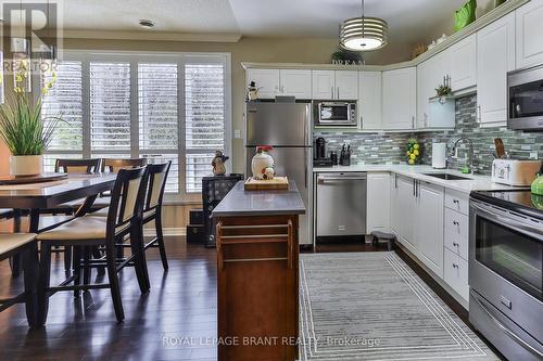 #104 - 255 Keats Way, Waterloo, ON - Indoor Photo Showing Kitchen With Upgraded Kitchen