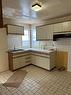 111 7Th Street N, Brandon, MB  - Indoor Photo Showing Kitchen With Double Sink 