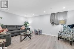 Living room with light hardwood / wood-style floors - 