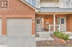 Doorway to property featuring a garage - 