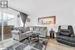 Living room with wood-type flooring - 