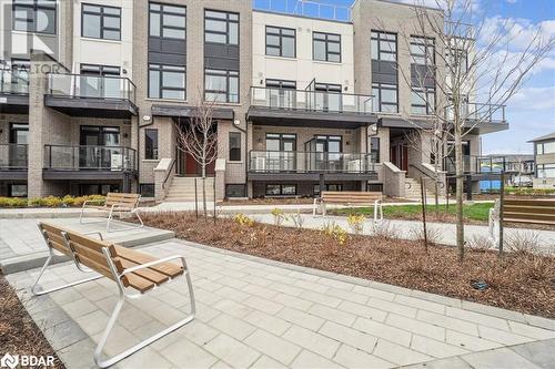 View of property's community - 1569 Rose Way Unit# 104, Milton, ON - Outdoor With Balcony With Facade