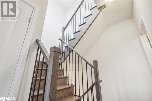 Stairs with hardwood / wood-style flooring - 1569 Rose Way Unit# 104, Milton, ON - Indoor Photo Showing Other Room