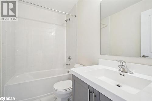 Full bathroom featuring tiled shower / bath, vanity, and toilet - 1569 Rose Way Unit# 104, Milton, ON - Indoor Photo Showing Bathroom