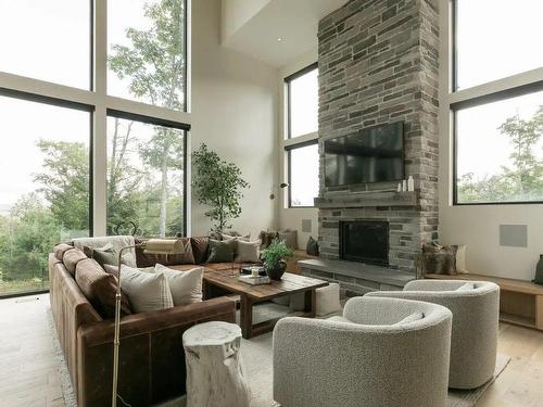 Living room - 30 Mtée De Kicking Horse, Morin-Heights, QC - Indoor Photo Showing Living Room With Fireplace