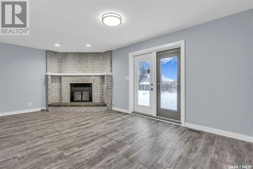 119 Aspen Place, Regina, SK - Indoor Photo Showing Living Room With Fireplace