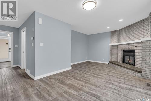 119 Aspen Place, Regina, SK - Indoor With Fireplace