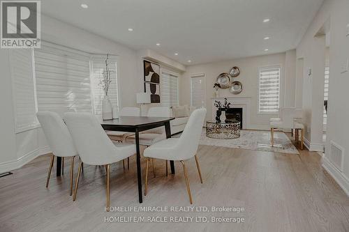 305 Fasken Court, Milton, ON - Indoor Photo Showing Dining Room With Fireplace