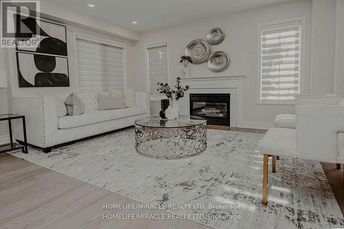 305 Fasken Court, Milton, ON - Indoor Photo Showing Living Room With Fireplace