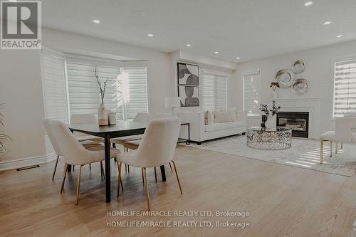 305 Fasken Court, Milton, ON - Indoor Photo Showing Dining Room With Fireplace