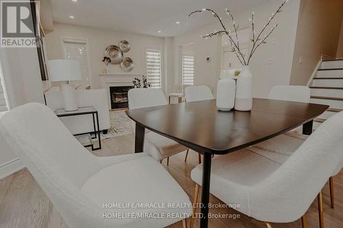 305 Fasken Court, Milton, ON - Indoor Photo Showing Dining Room With Fireplace