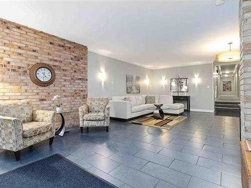 403-1159 Beach Dr, Oak Bay, BC - Indoor Photo Showing Living Room With Fireplace