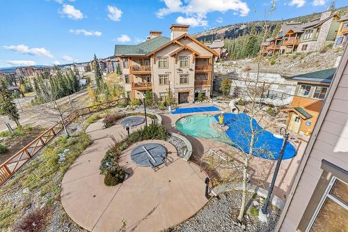 305/305A-255 Feathertop Way, Big White, BC - Outdoor With In Ground Pool