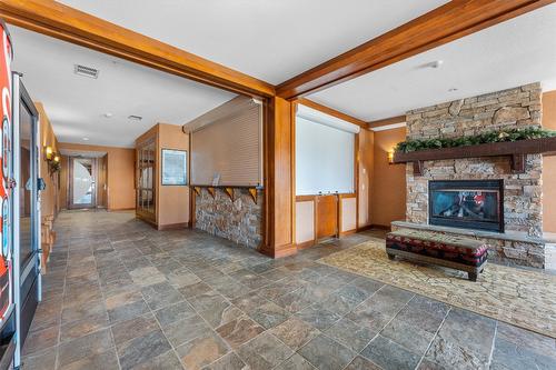 305/305A-255 Feathertop Way, Big White, BC - Indoor With Fireplace