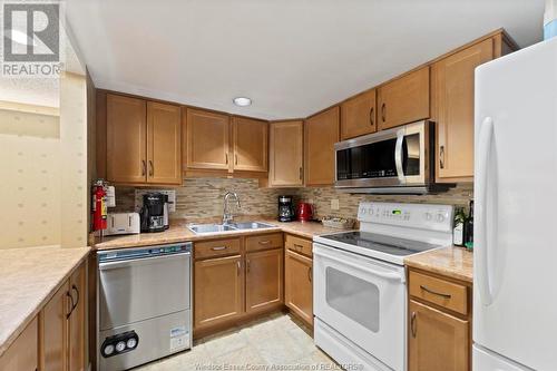 75 Riverside Drive East Unit# 901, Windsor, ON - Indoor Photo Showing Kitchen With Double Sink