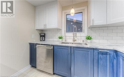 Granite counters contrast with the cabinetry. - 6 Fran Ellen Crescent, Kitchener, ON - Indoor Photo Showing Kitchen With Double Sink