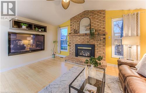 Natural light from the rear windows. - 6 Fran Ellen Crescent, Kitchener, ON - Indoor Photo Showing Living Room With Fireplace