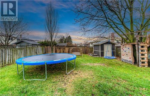 Yard at dusk with a storage shed - 6 Fran Ellen Crescent, Kitchener, ON - Outdoor With Backyard