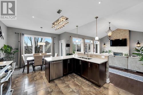 31 - 18 Upper Highland, New Tecumseth, ON - Indoor Photo Showing Kitchen With Fireplace With Double Sink With Upgraded Kitchen