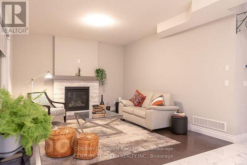 64 Burton Street, East Zorra-Tavistock, ON - Indoor Photo Showing Living Room With Fireplace