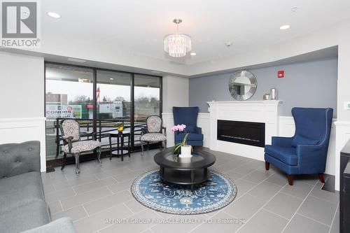 407 - 58 Glenelg Street, Kawartha Lakes (Lindsay), ON - Indoor Photo Showing Living Room With Fireplace