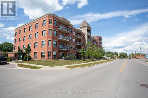 407 - 58 Glenelg Street, Kawartha Lakes (Lindsay), ON - Outdoor With Balcony With Facade