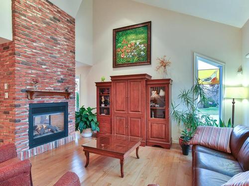 Living room - 147 Rue Maxime, Saint-Jean-Sur-Richelieu, QC - Indoor Photo Showing Living Room With Fireplace