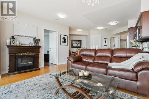 1208 - 2240 Lakeshore Boulevard W, Toronto, ON - Indoor Photo Showing Living Room With Fireplace