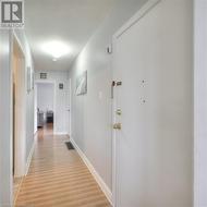 Corridor featuring light hardwood / wood-style flooring - 