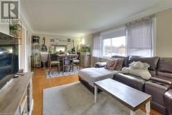 Living room featuring light hardwood / wood-style floors - 