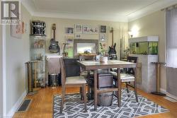 Dining room featuring wood-type flooring - 