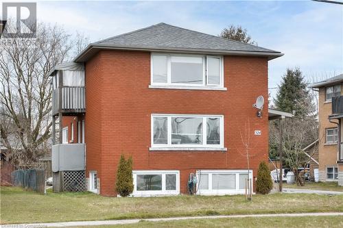 View of side of home featuring a yard - 524 Krug Street, Kitchener, ON - Outdoor With Exterior