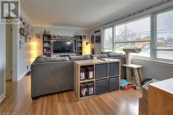 Living room with wood-type flooring - 