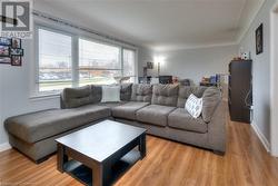 Living room with light wood-type flooring - 