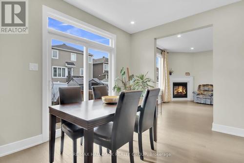 77 Axel Crescent, Ottawa, ON - Indoor Photo Showing Dining Room With Fireplace