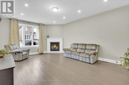 77 Axel Crescent, Ottawa, ON - Indoor Photo Showing Living Room With Fireplace