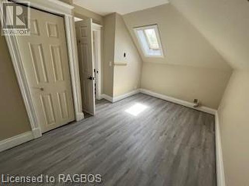 Bonus room with dark hardwood / wood-style flooring and lofted ceiling with skylight - 745 4Th Avenue East Avenue, Owen Sound, ON 