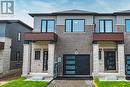 View of front of house with a garage - 155 Equestrian Way Unit# 60, Cambridge, ON  - Outdoor With Facade 