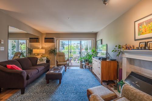 111-1445 Halifax Street, Penticton, BC - Indoor Photo Showing Living Room With Fireplace