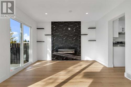 256 Abinger Crescent Ne, Calgary, AB - Indoor Photo Showing Living Room With Fireplace