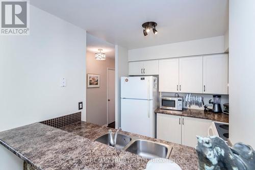 1502 - 140 Dunlop Street E, Barrie, ON - Indoor Photo Showing Kitchen With Double Sink