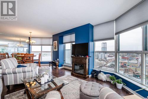 1502 - 140 Dunlop Street E, Barrie, ON - Indoor Photo Showing Living Room With Fireplace