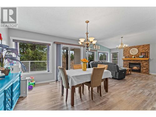 522 Caouette Road, Sorrento, BC - Indoor Photo Showing Dining Room With Fireplace