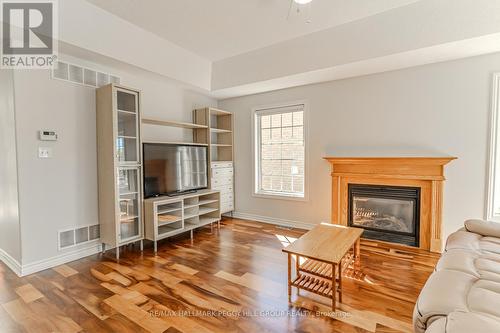 121 Sovereigns Gate, Barrie, ON - Indoor Photo Showing Living Room With Fireplace