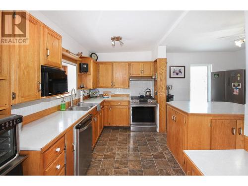 16020 Tupper Village Way, Dawson Creek, BC - Indoor Photo Showing Kitchen With Double Sink