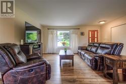 Living room featuring light hardwood / wood-style flooring - 